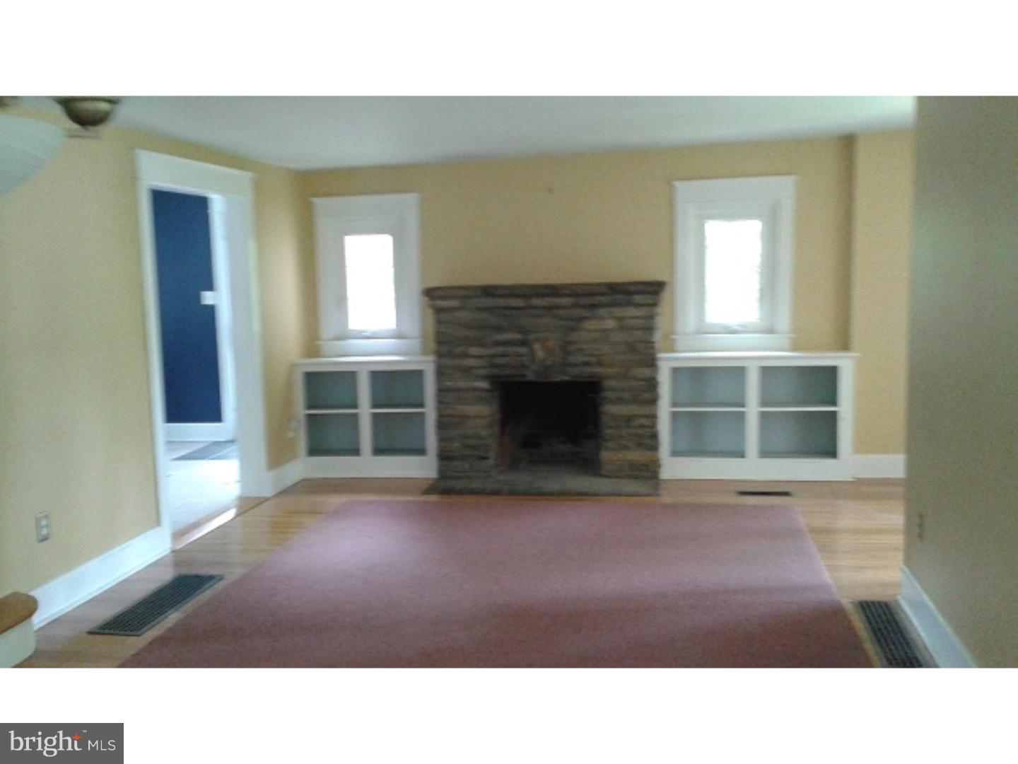 1507 Old Orchard Road Media, PA 19063 - Photo 2 of 14 a room with a fireplace and a large window