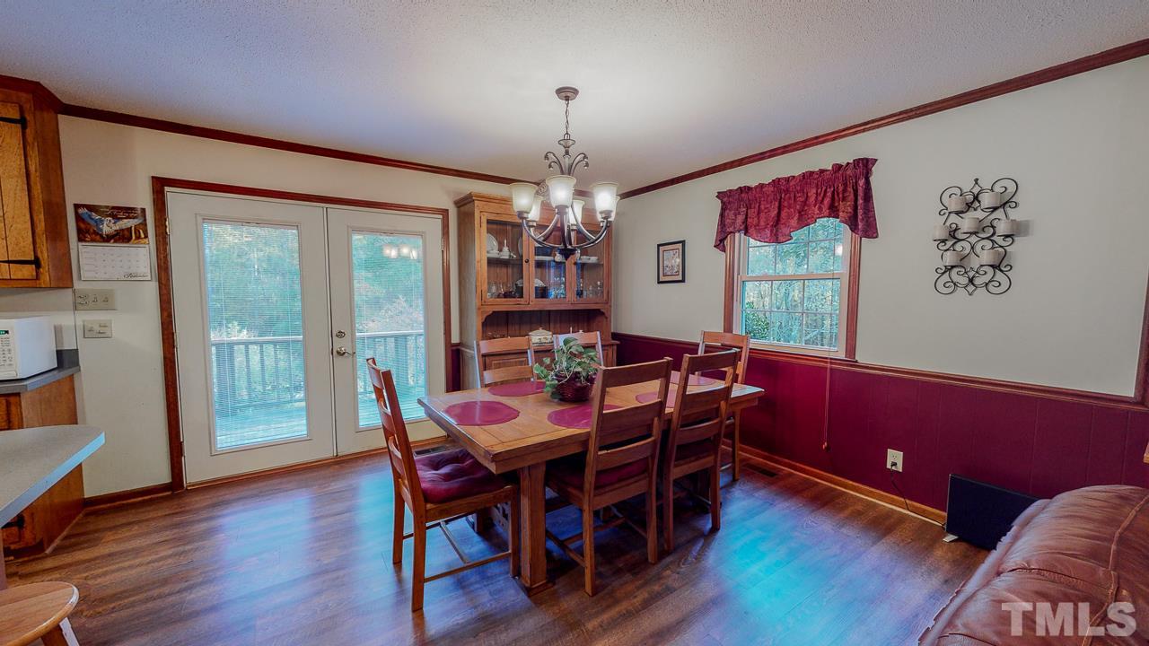 1307 Bill Poole Road Rougemont, NC 27572 - Photo 15 of 30 a view of a dining room with furniture window and wooden floor
