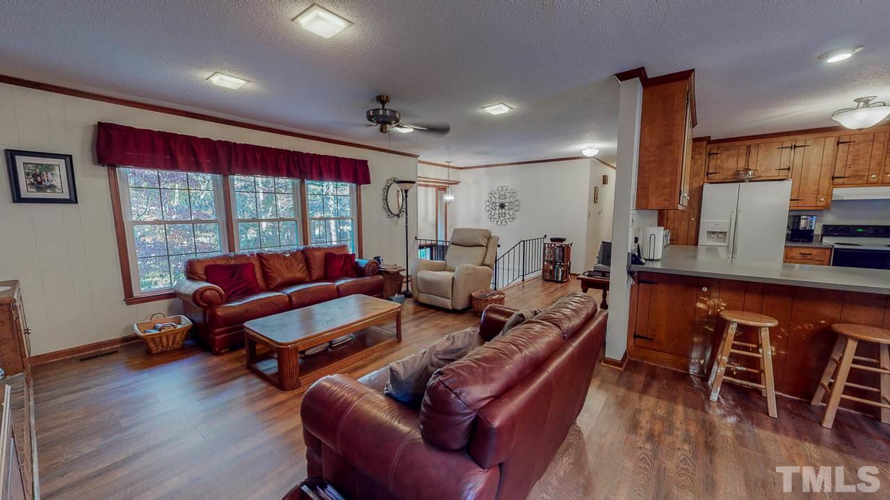 1307 Bill Poole Road Rougemont, NC 27572 - Photo 3 of 30 a living room with furniture a wooden floor and next to a window