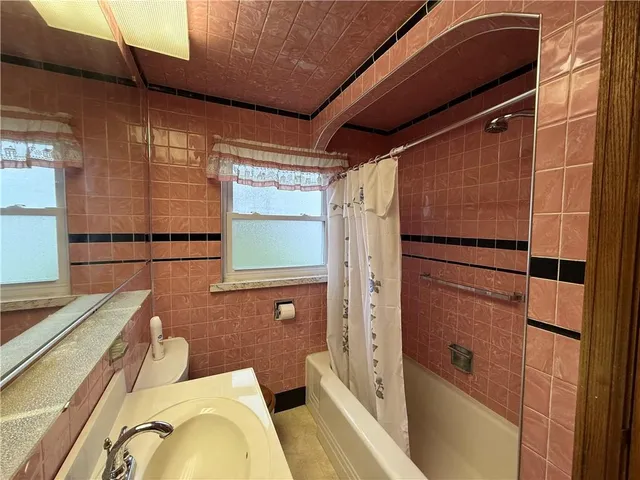 a view of a livingroom with furniture and staircase