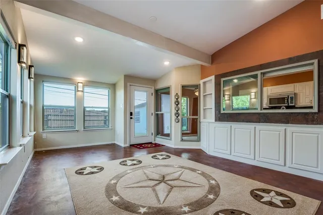 a living room with furniture and a large window