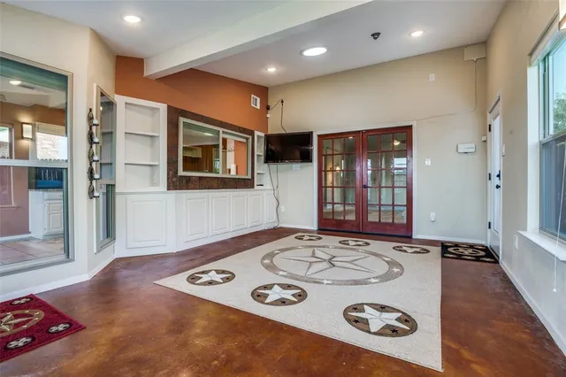 a view of a livingroom with furniture and window