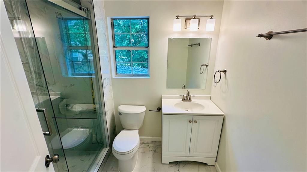 3428 Chapel Park Drive Decatur, GA 30034 - Photo 20 of 35 a bathroom with a toilet sink and mirror