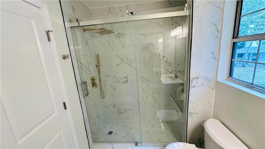 3428 Chapel Park Drive Decatur, GA 30034 - Photo 21 of 35 a bathroom with a shower and a toilet