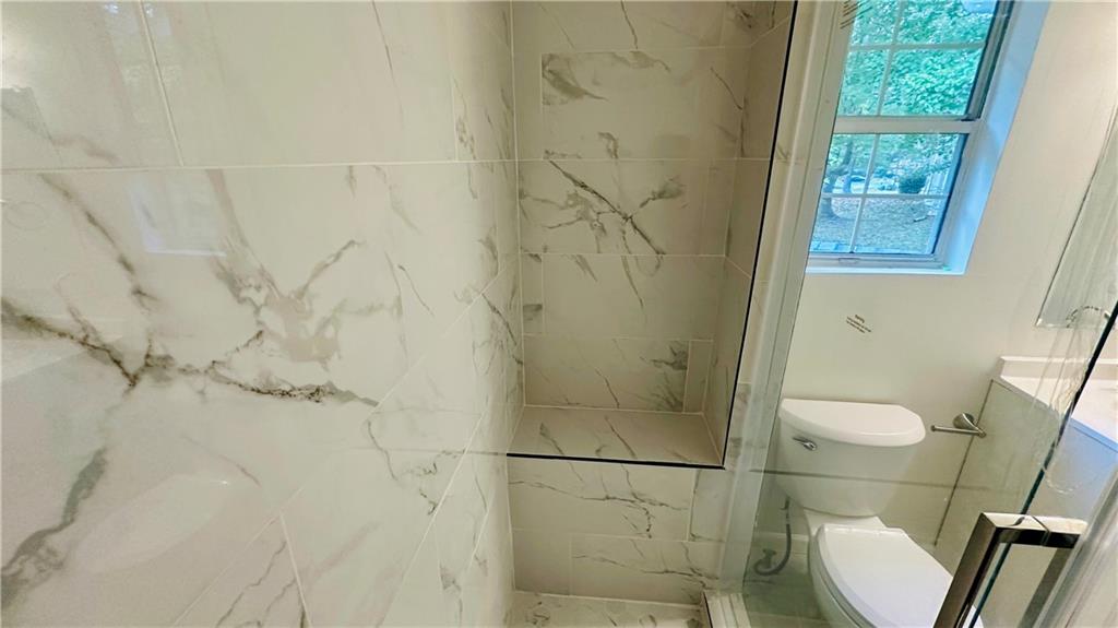 3428 Chapel Park Drive Decatur, GA 30034 - Photo 23 of 35 a bathroom with a toilet and a shower