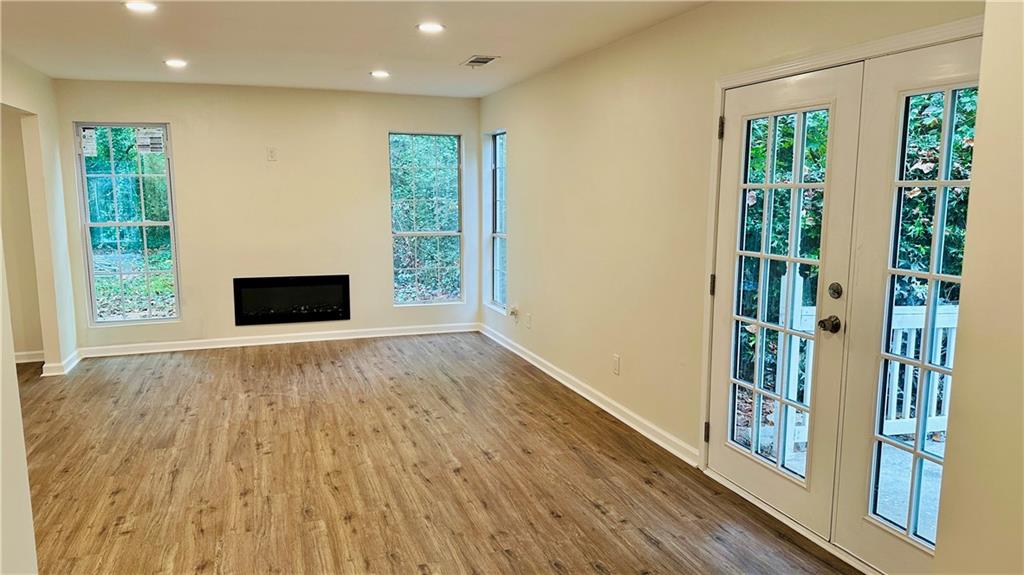 3428 Chapel Park Drive Decatur, GA 30034 - Photo 6 of 35 a view of an empty room with wooden floor and a window