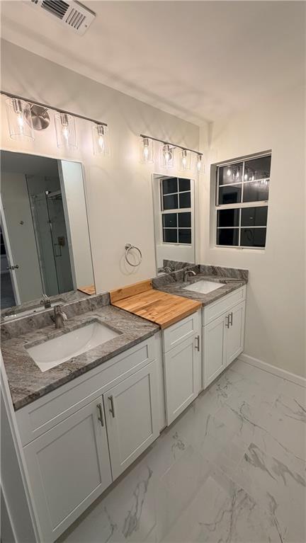 3428 Chapel Park Drive Decatur, GA 30034 - Photo 9 of 35 a bathroom with a granite countertop sink and a mirror