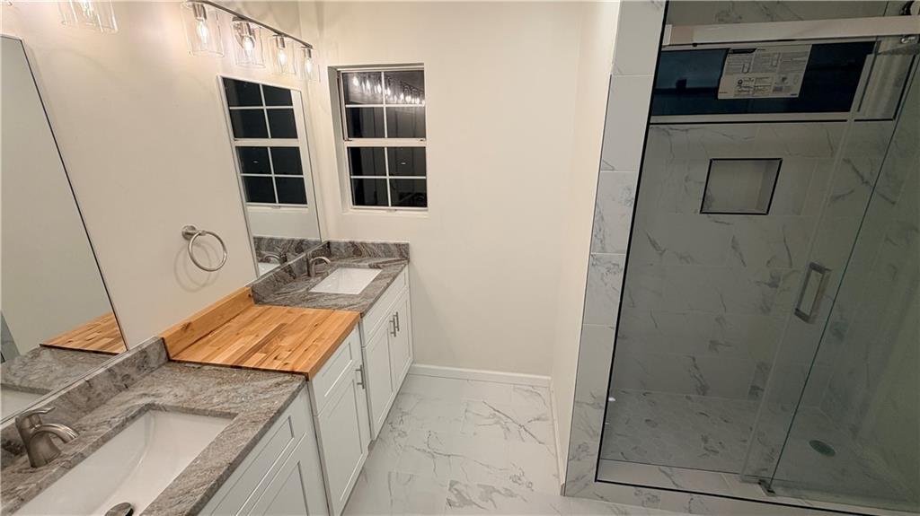 3428 Chapel Park Drive Decatur, GA 30034 - Photo 10 of 35 a bathroom with a granite countertop sink and a shower