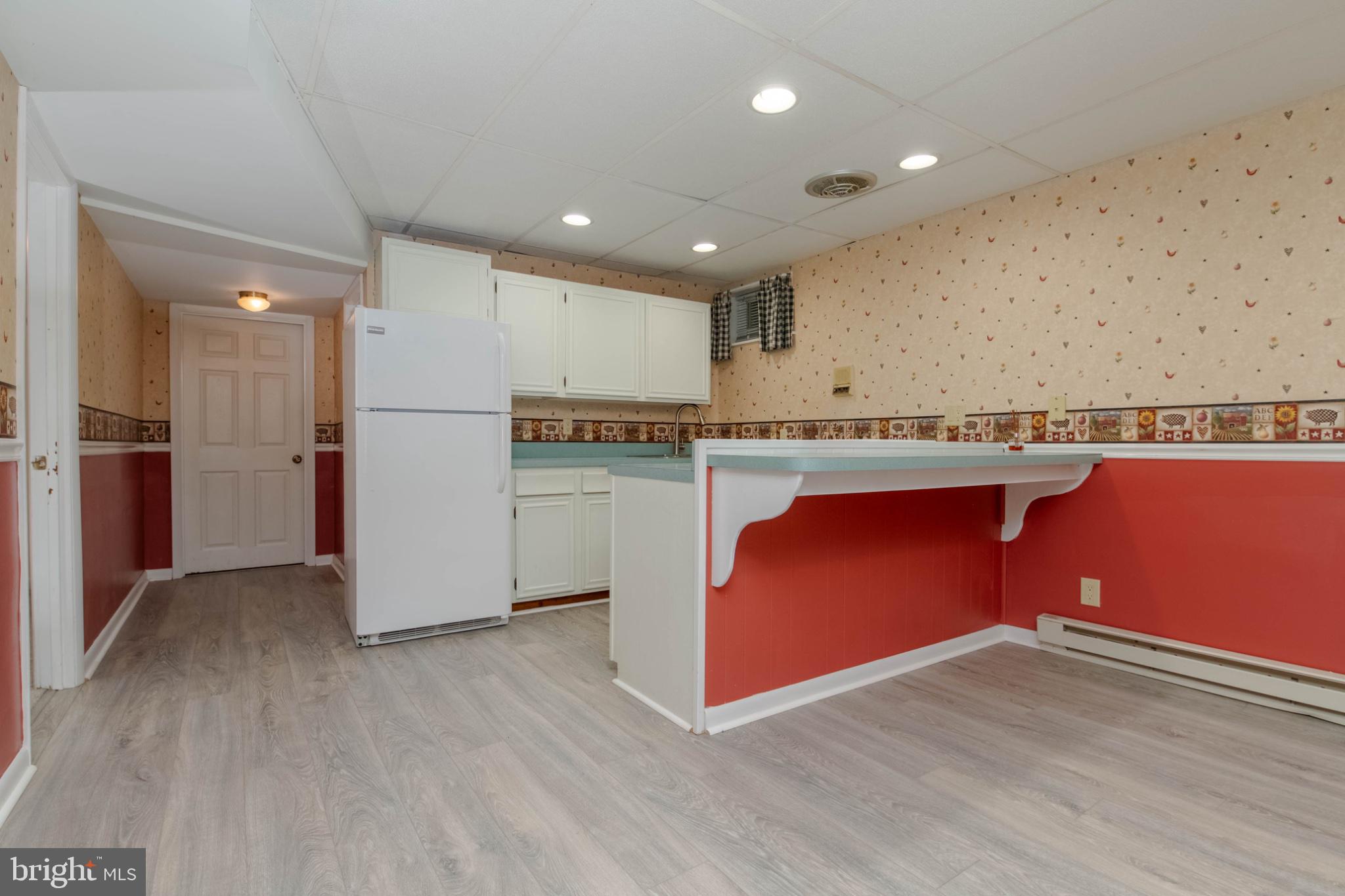 1909 Nelson Mill Road Jarrettsville, MD 21084 - Photo 47 of 65 a kitchen with stainless steel appliances granite countertop a refrigerator a sink dishwasher a stove with wooden floor