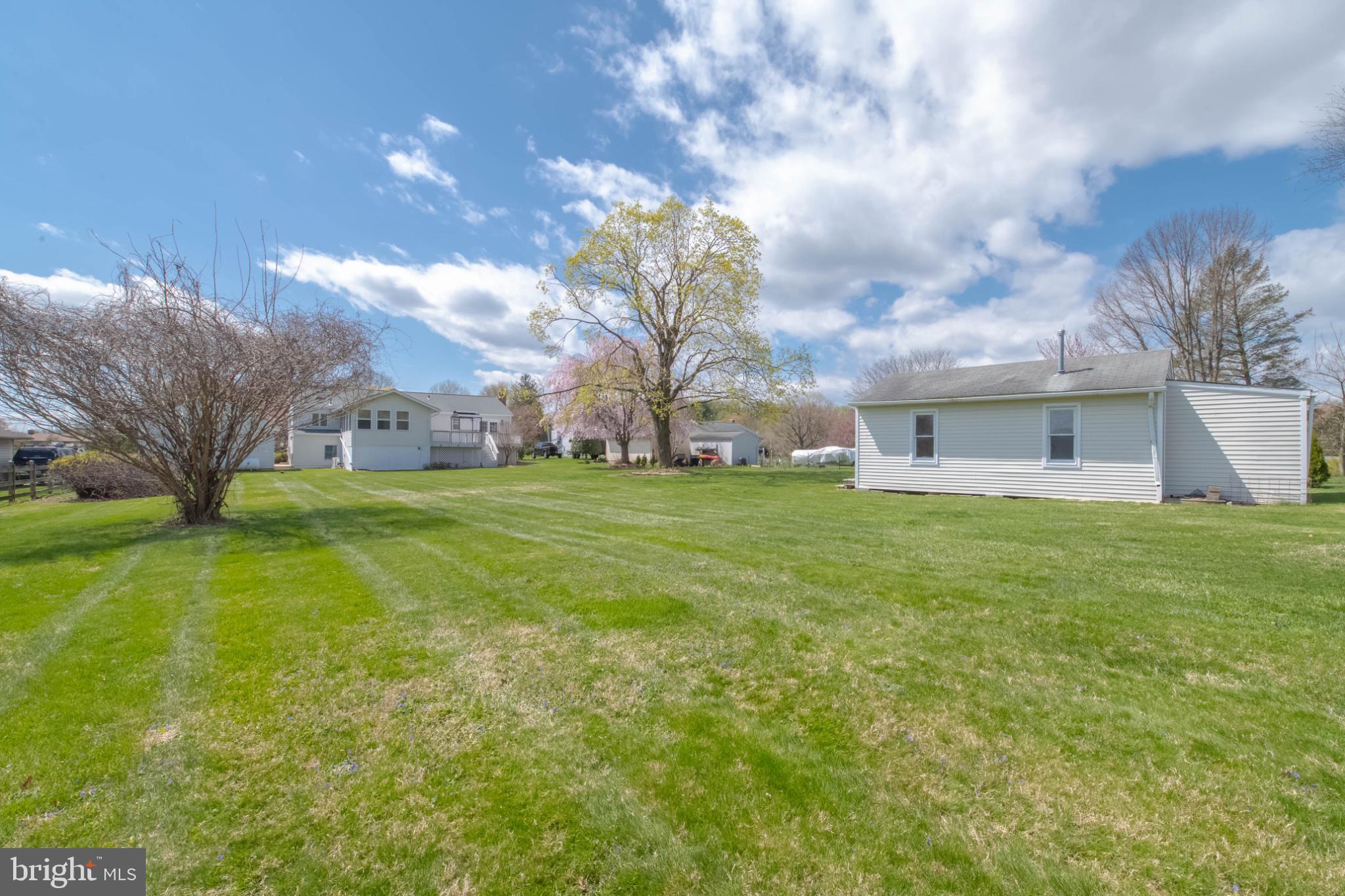 1909 Nelson Mill Road Jarrettsville, MD 21084 - Photo 7 of 65 Spacious lawn under a bright sky.