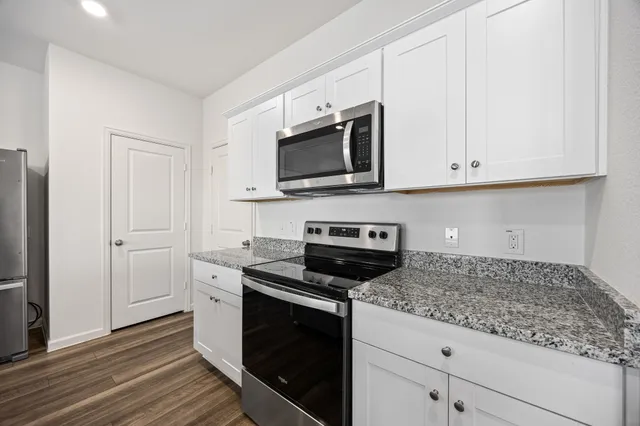 a living room with furniture a table and a window