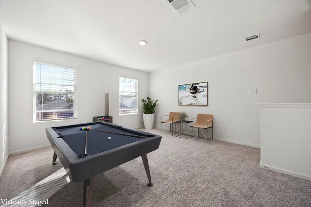 a bedroom with a bed and a television