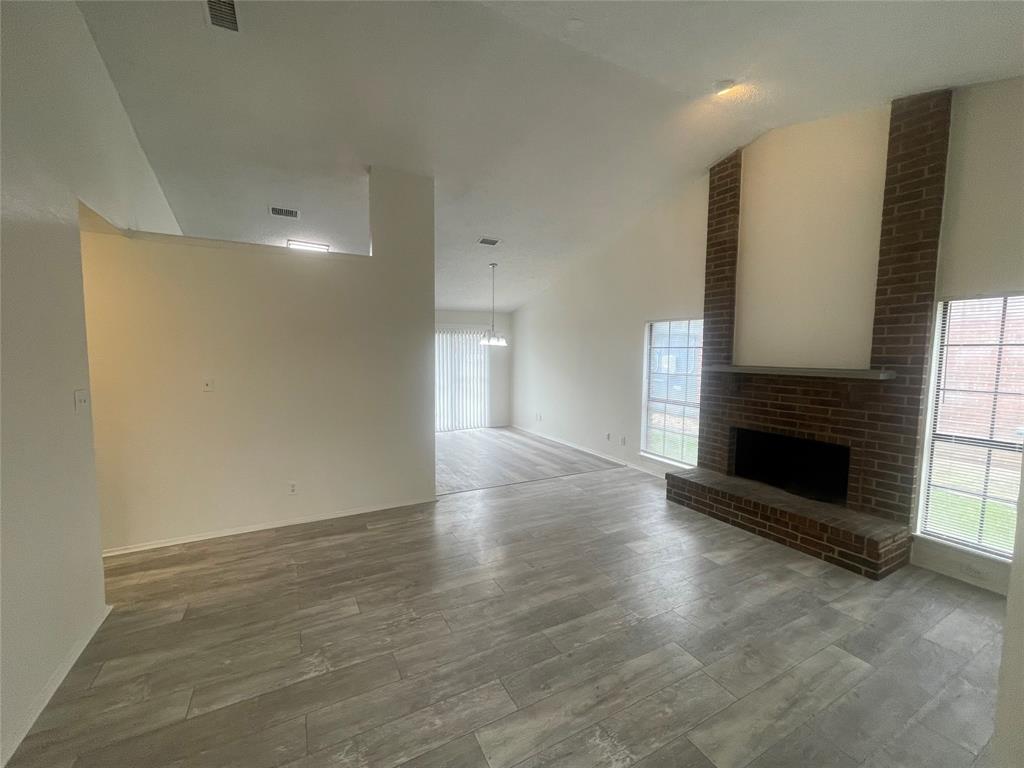 9415 Rutherglen Drive Dallas, TX 75227 - Photo 3 of 18 a view of a livingroom with a fireplace