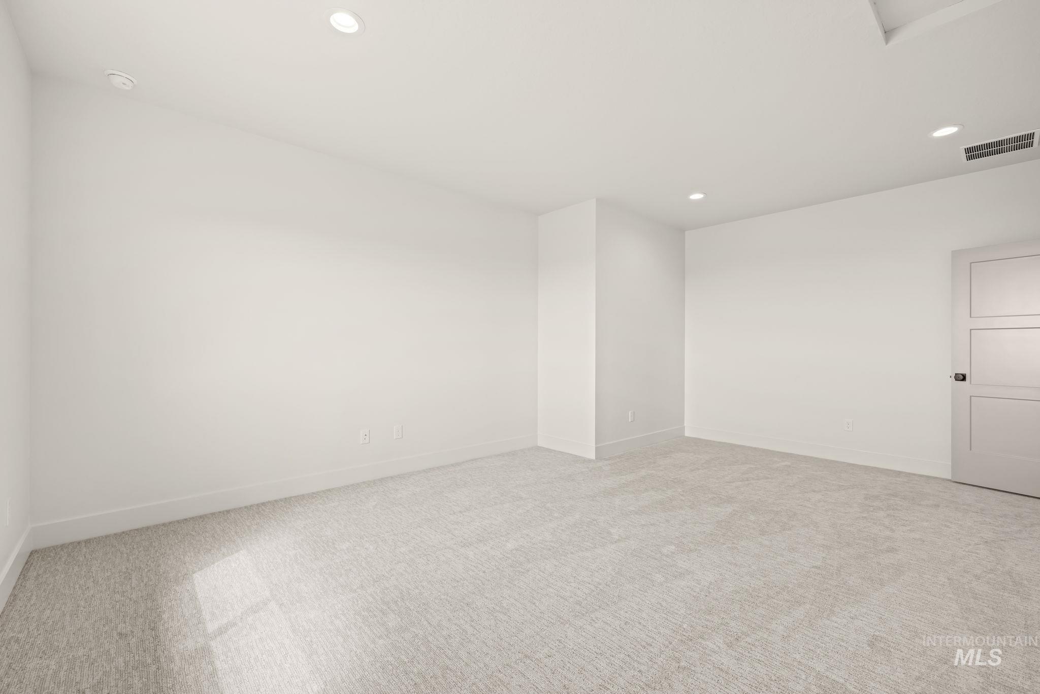 345 South Strut Way Boise, ID 83716 - Photo 46 of 50 Recessed lighting, light-toned carpeting, white walls, and a contemporary panel door