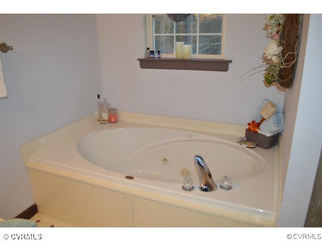 3233 Ransom Hills Road Richmond, VA 23237 - Photo 11 of 15 a bathroom with a bathtub
