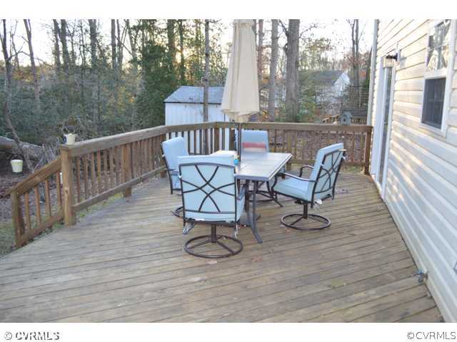 3233 Ransom Hills Road Richmond, VA 23237 - Photo 13 of 15 a view of a chairs and table on the deck