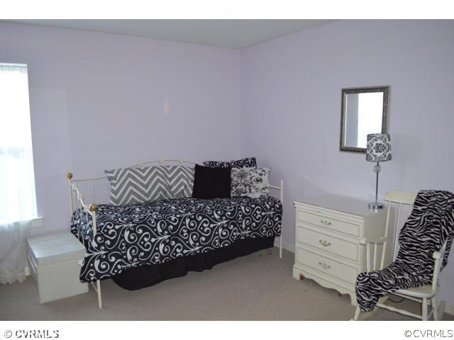 3233 Ransom Hills Road Richmond, VA 23237 - Photo 9 of 15 a bed room with a bed and a dresser