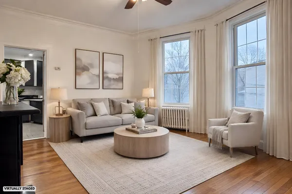 a living room with furniture and a large window