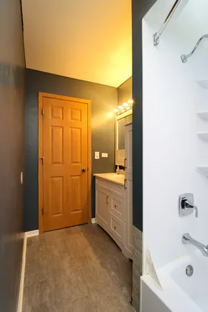 a view of a room with wooden floor and cabinet