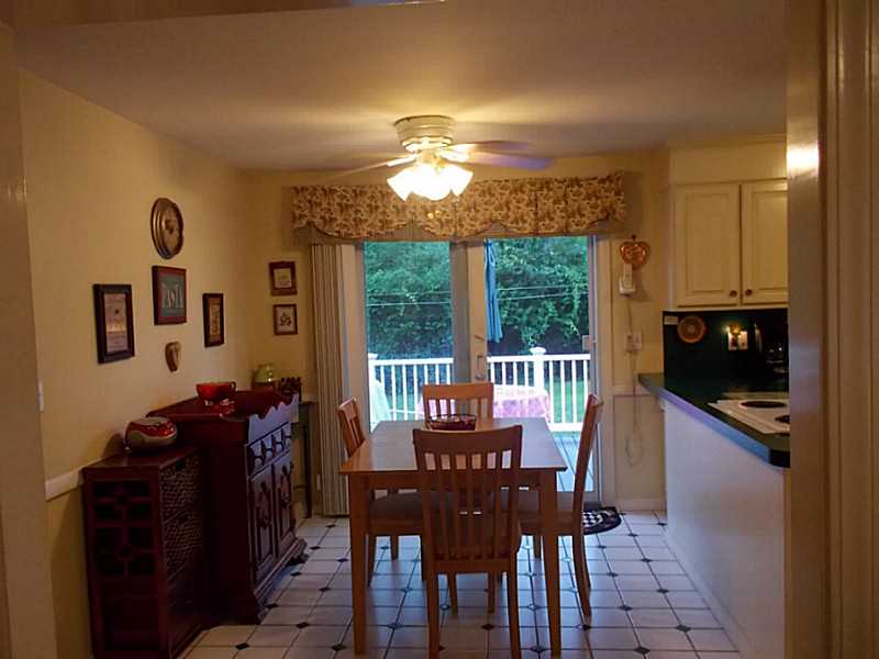 Kitchen. Kitchen dining area is convenient to the deck and open to the living room. watch tv from the kitchen!
