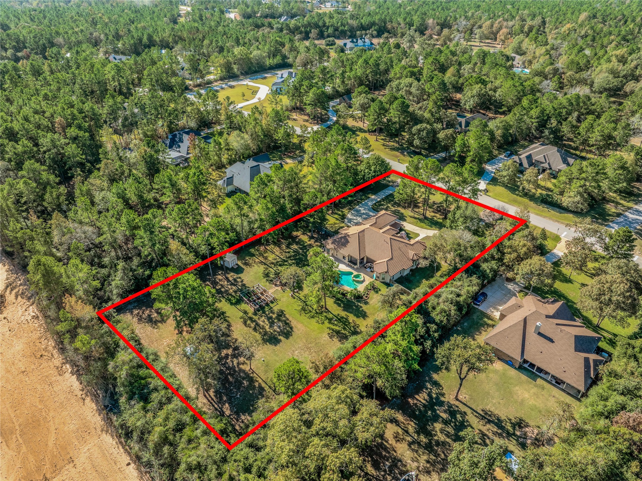an aerial view of a residential houses with swimming pool and outdoor space