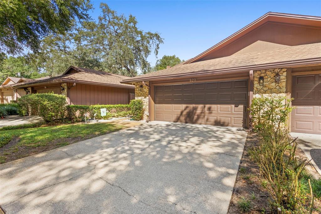 920 Shady Branch Trail DeLand, FL 32724 - Photo 12 of 46 a front view of a house with garden