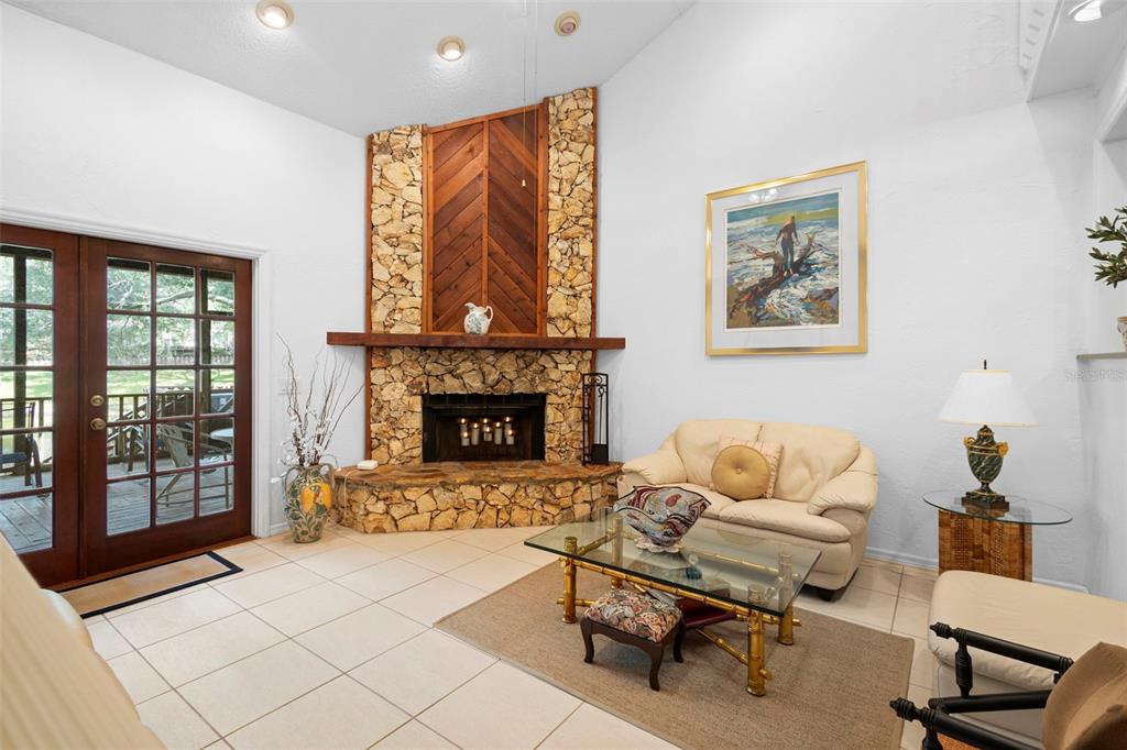 920 Shady Branch Trail DeLand, FL 32724 - Photo 15 of 46 a living room with furniture and a fireplace