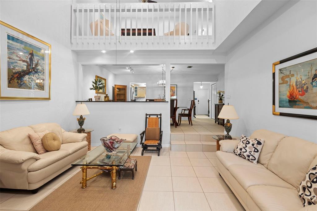 920 Shady Branch Trail DeLand, FL 32724 - Photo 17 of 46 a living room with furniture and kitchen view