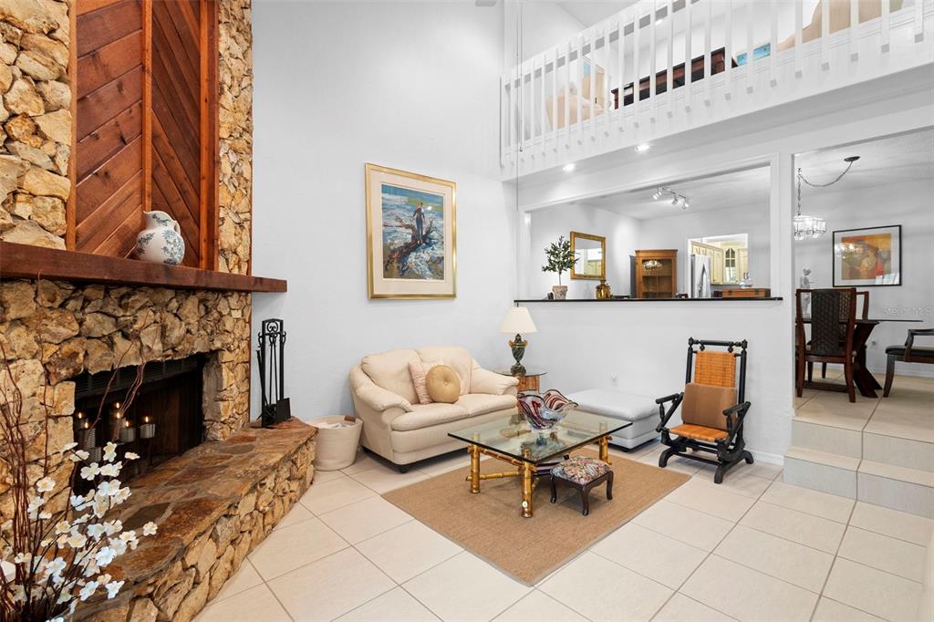 920 Shady Branch Trail DeLand, FL 32724 - Photo 18 of 46 a living room with furniture and a fireplace