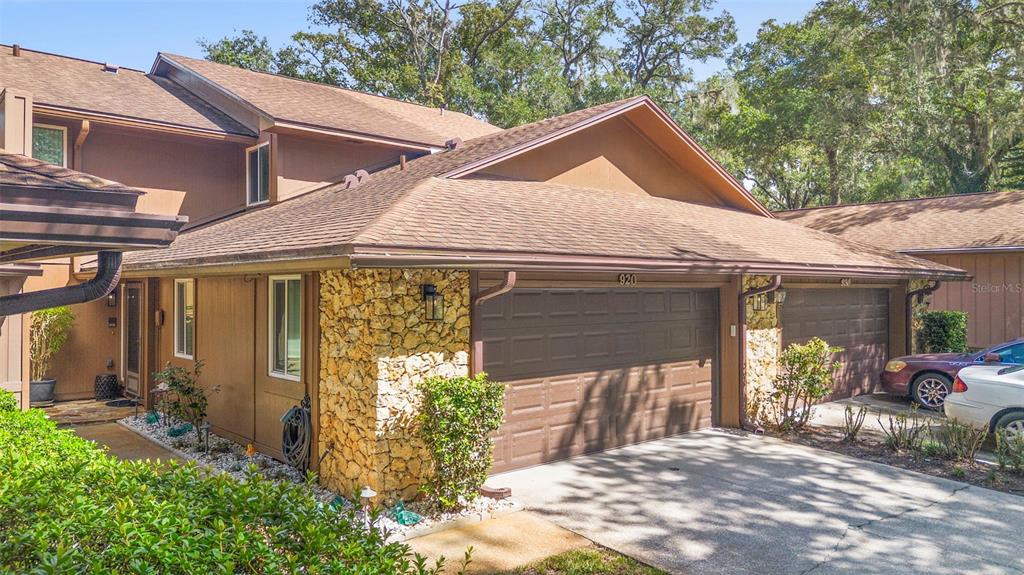 920 Shady Branch Trail DeLand, FL 32724 - Photo 2 of 46 a front view of a house with garden