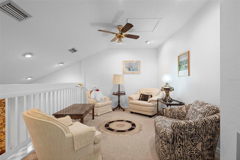 920 Shady Branch Trail DeLand, FL 32724 - Photo 26 of 46 a living room with furniture and a rug