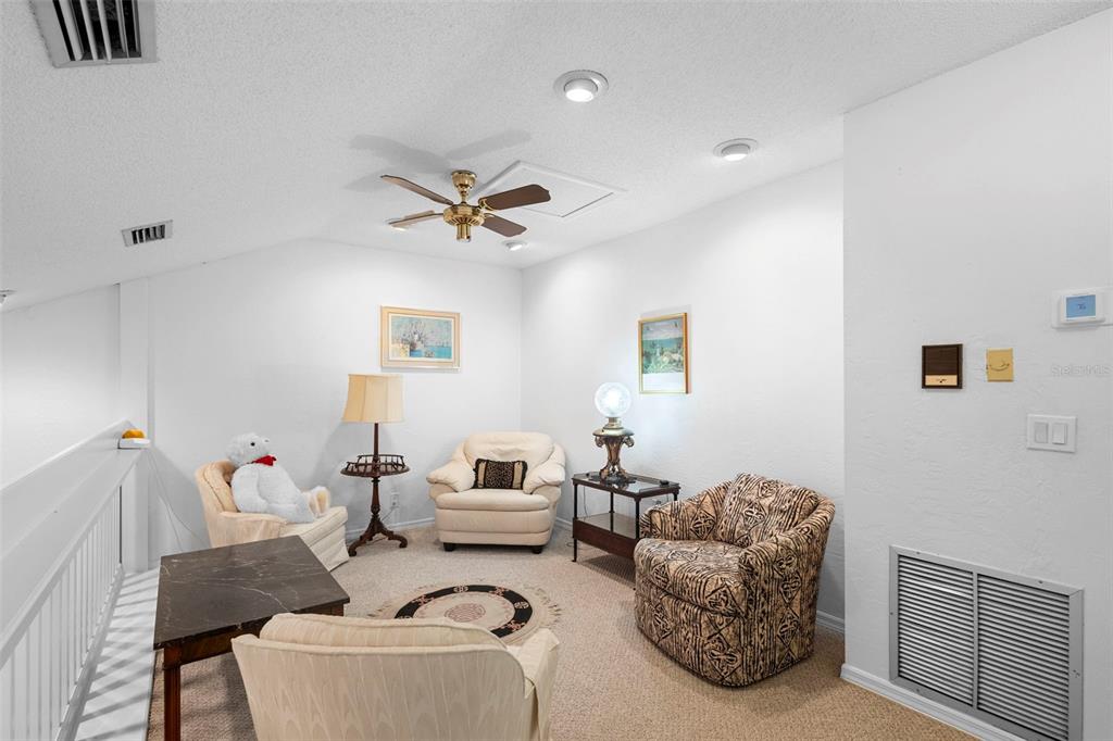 920 Shady Branch Trail DeLand, FL 32724 - Photo 30 of 46 a living room with furniture and a ceiling fan