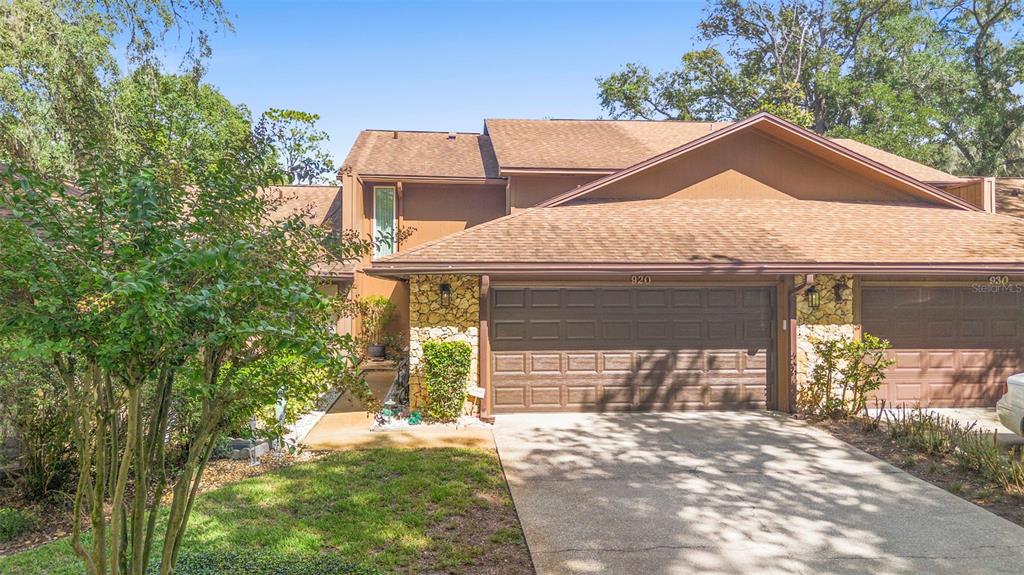 920 Shady Branch Trail DeLand, FL 32724 - Photo 3 of 46 a front view of a house with a yard and garage