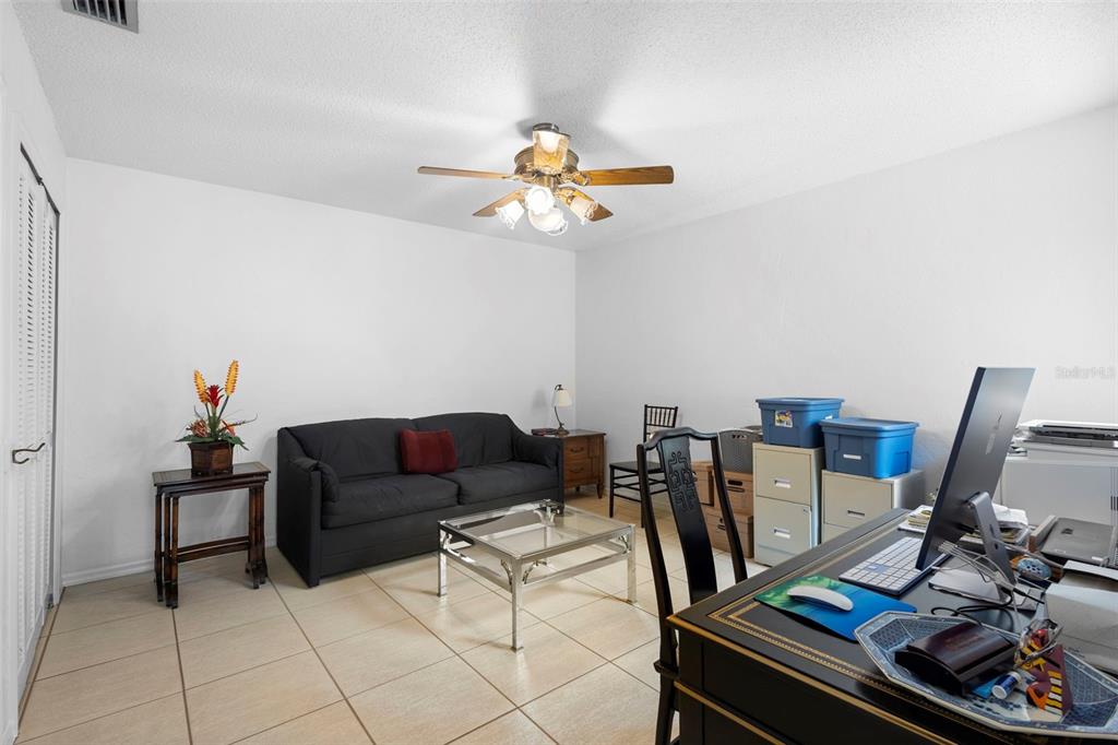 920 Shady Branch Trail DeLand, FL 32724 - Photo 39 of 46 a living room with furniture and a chandelier