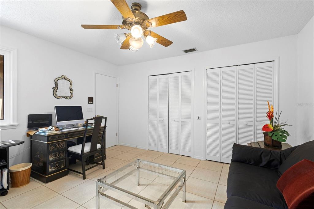 920 Shady Branch Trail DeLand, FL 32724 - Photo 40 of 46 a living room with furniture and a work place area