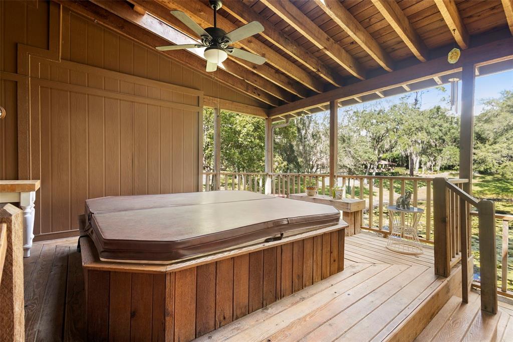 920 Shady Branch Trail DeLand, FL 32724 - Photo 45 of 46 a kitchen with a stove and wooden cabinets