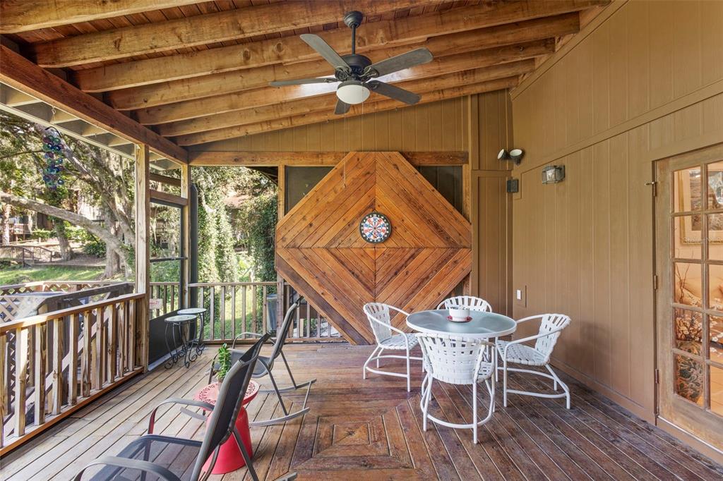 920 Shady Branch Trail DeLand, FL 32724 - Photo 46 of 46 a view of a dining room with furniture window and wooden floor