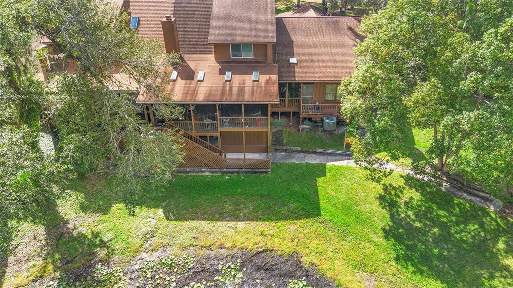 920 Shady Branch Trail DeLand, FL 32724 - Photo 6 of 46 an aerial view of a house with a yard