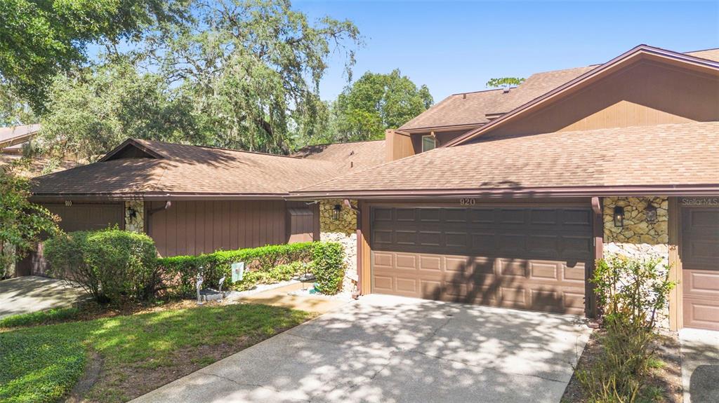 920 Shady Branch Trail DeLand, FL 32724 - Photo 7 of 46 a front view of a house with a yard and garage