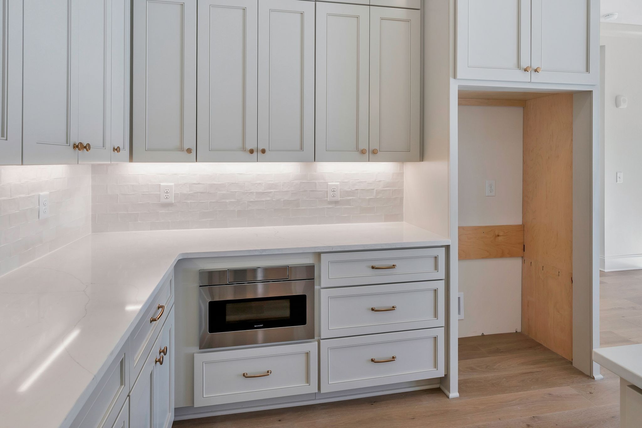 6037 Whitman Road, Unit 202 Franklin, TN 37064 - Photo 21 of 51 a kitchen with granite countertop white cabinets and white appliances