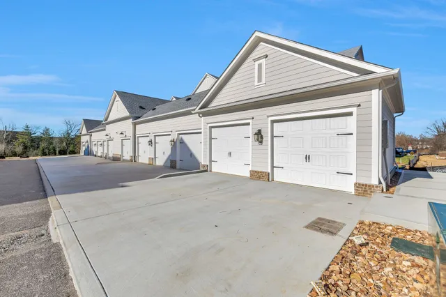 a view of a house with backyard and porch