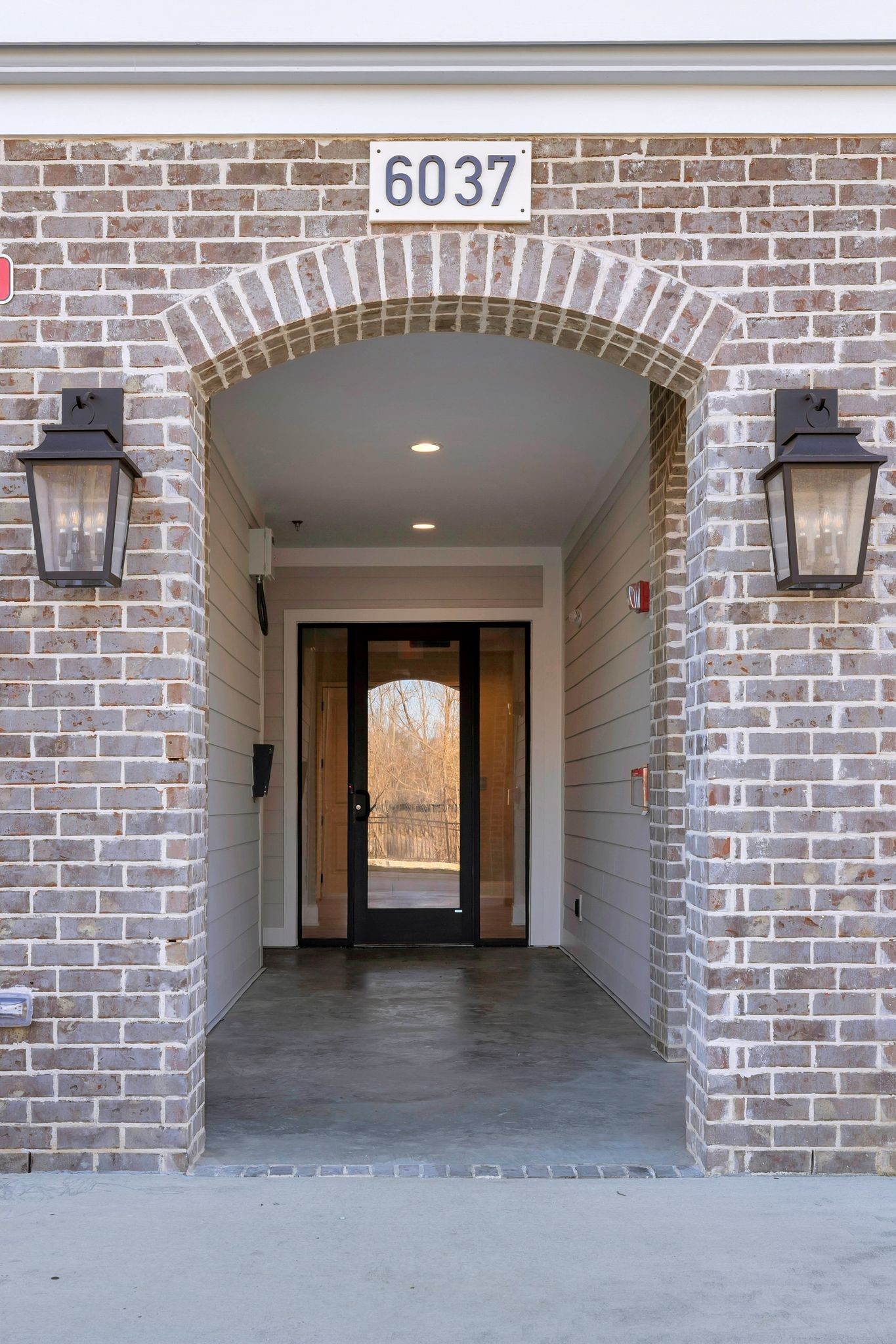 6037 Whitman Road, Unit 202 Franklin, TN 37064 - Photo 5 of 51 a front view of a building with a garage