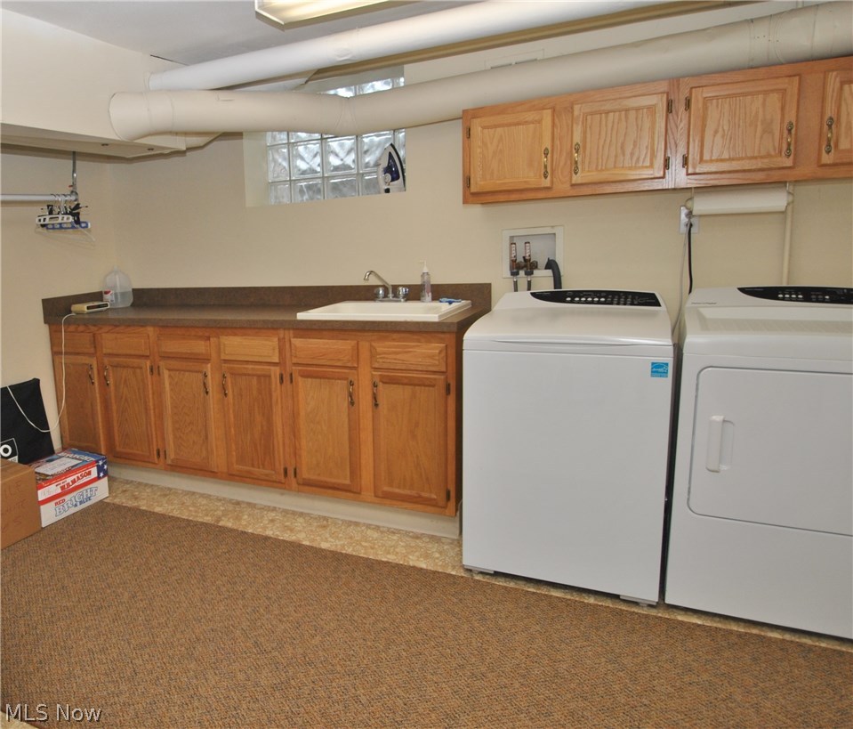 2881 Bellaire Road Silver Lake, OH 44224 - Photo 26 of 29 The large laundry room includes sink and built in cabinets