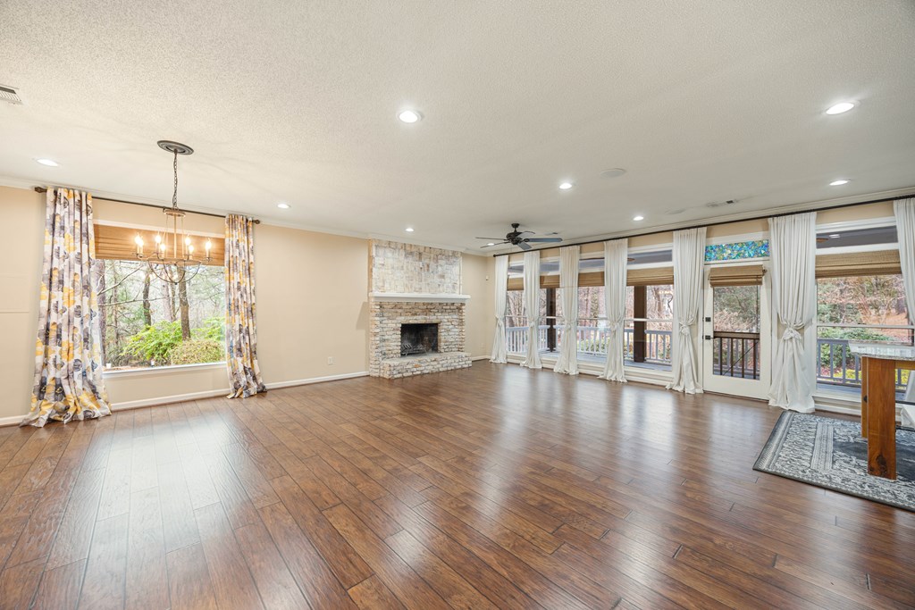 717 Double Churches Road Columbus, GA 31904 - Photo 29 of 54 an empty room with wooden floor and outdoor view