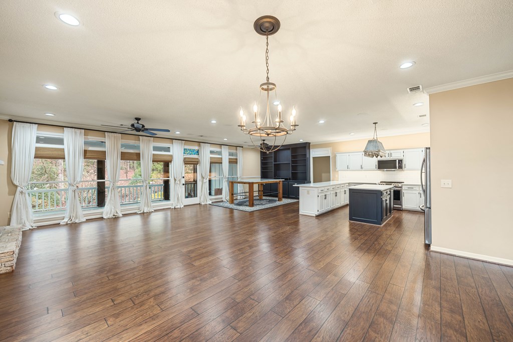 717 Double Churches Road Columbus, GA 31904 - Photo 30 of 54 a view of a living room and kitchen with a large window