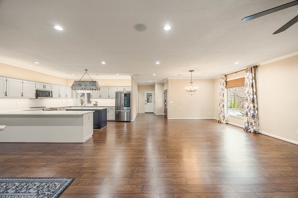 717 Double Churches Road Columbus, GA 31904 - Photo 31 of 54 a large white kitchen with a large window and stainless steel appliances