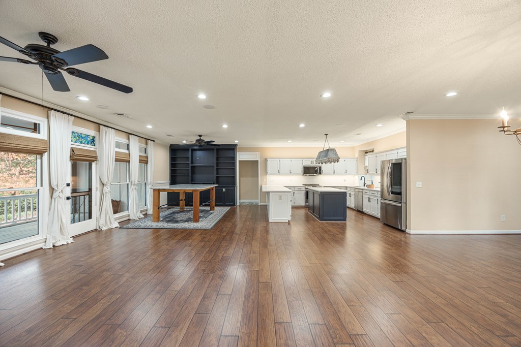 717 Double Churches Road Columbus, GA 31904 - Photo 32 of 54 a living room with stainless steel appliances kitchen island hard wood floors and fireplace
