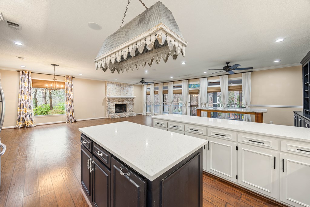 717 Double Churches Road Columbus, GA 31904 - Photo 34 of 54 a kitchen with a stove a sink a dining table and chairs