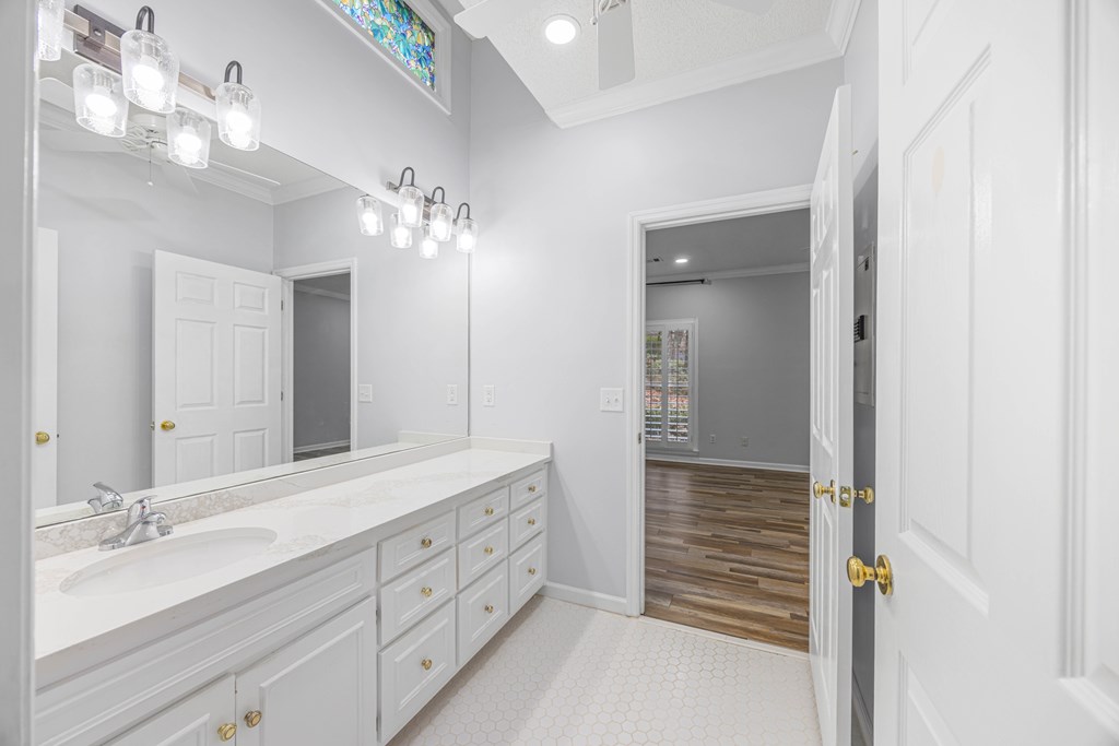 717 Double Churches Road Columbus, GA 31904 - Photo 43 of 54 a bathroom with a double vanity sink and a mirror