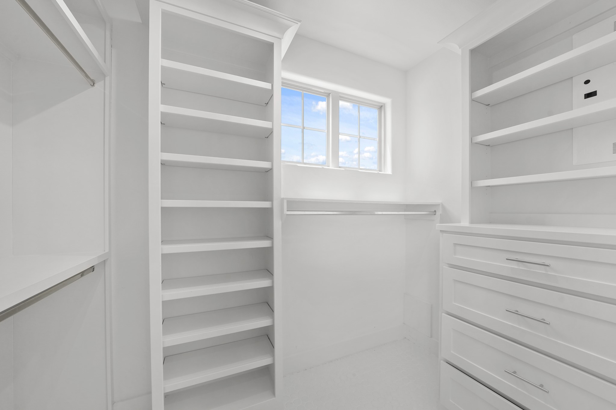 5343 Larkin Street Houston, TX 77007 - Photo 10 of 21 a view of walk in closet with empty racks